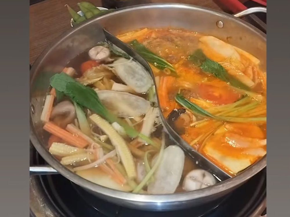 Japanese hot pot simmering with fresh vegetables and broth